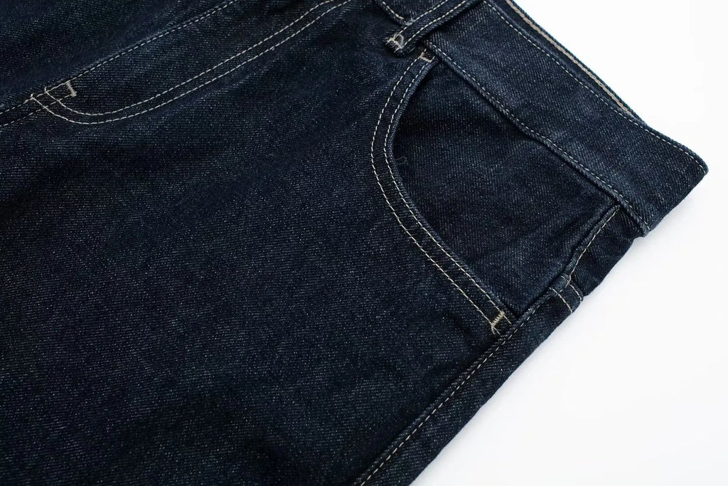 vintage denim women's outfit with a long-sleeve coat and wide-leg jeans