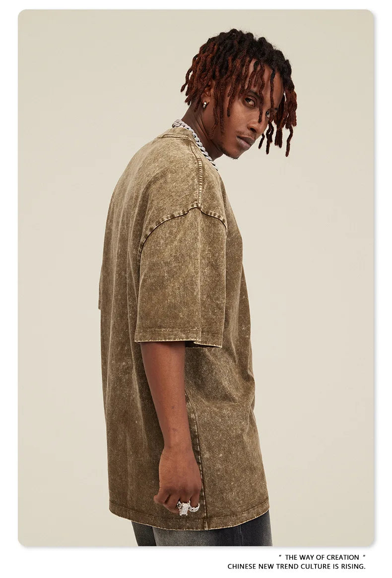 Here is a description based on your input:  Retro Arctic Monkeys Graphic T-Shirt, Vintage Washed, Oversized Fit, Y2K Style, Hip Hop Streetwear for Men