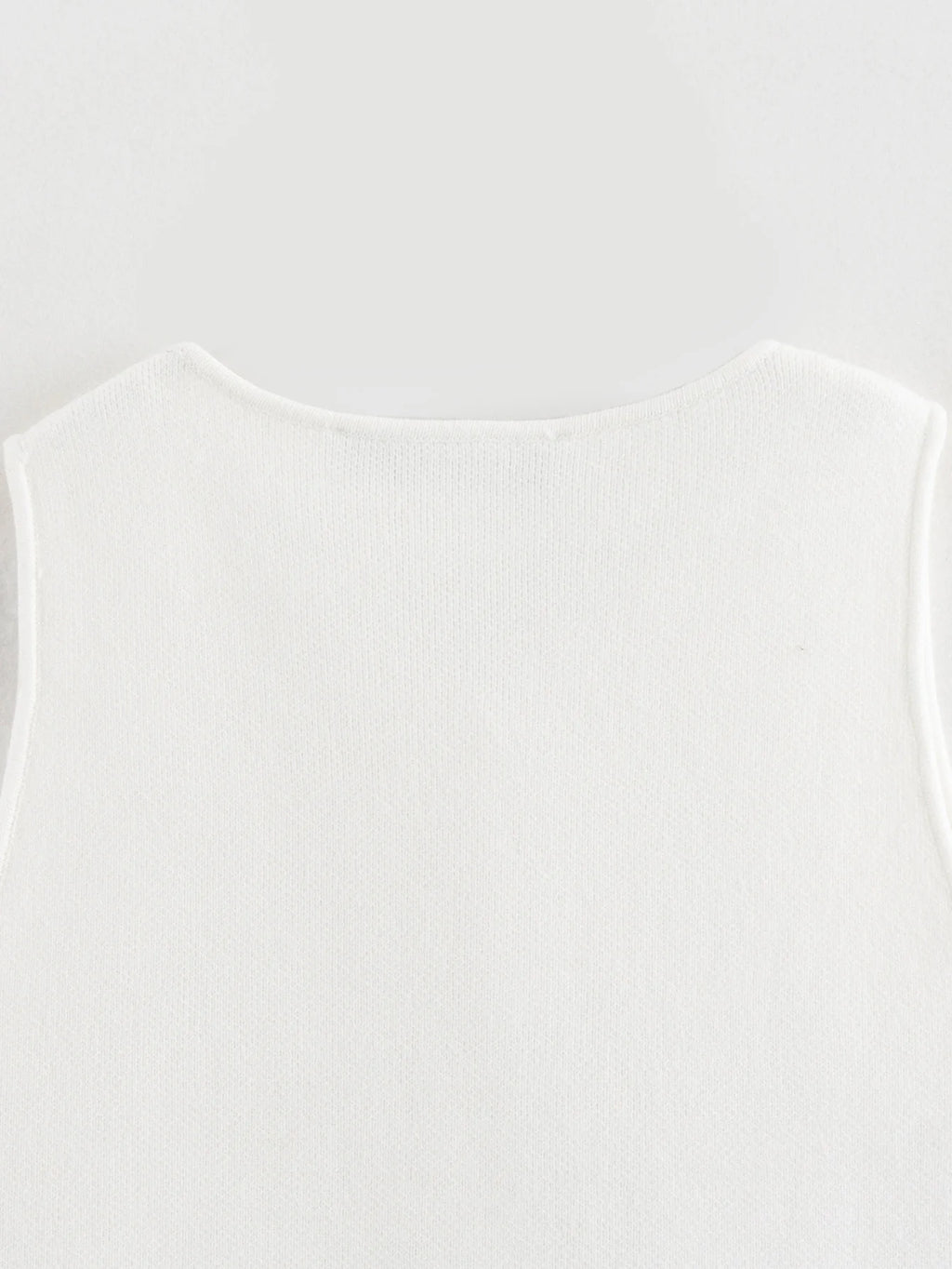 Pink sleeveless knit vest for women, cropped sweater top, yellow button design, streetwear waistcoat, stylish knitwear