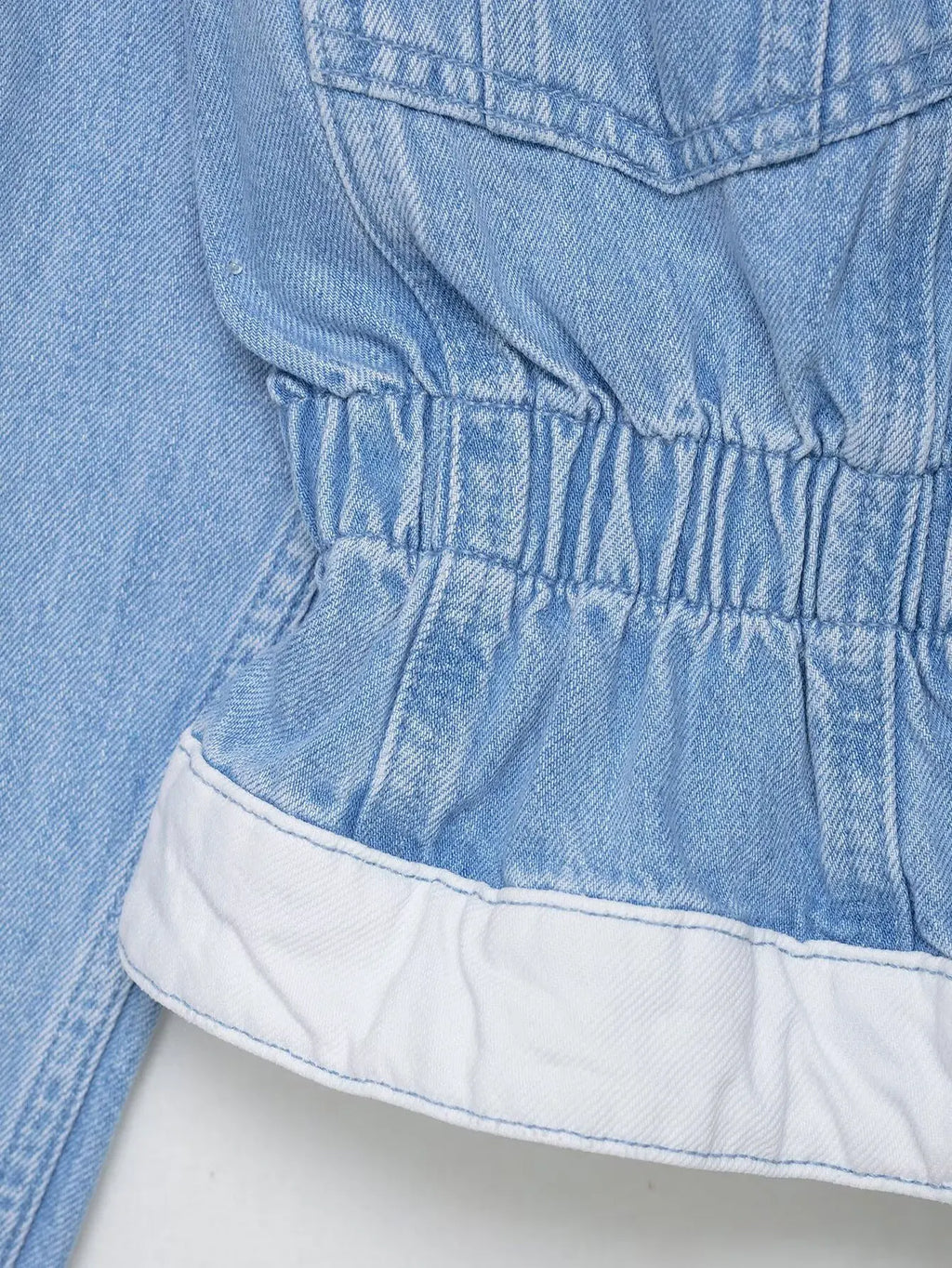 vintage denim women's outfit with a long-sleeve coat and wide-leg jeans