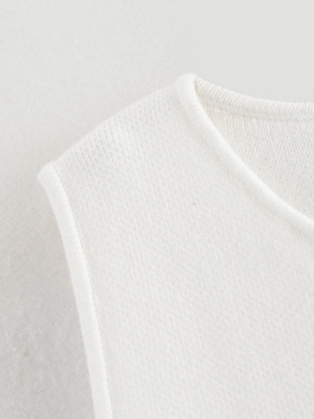 Pink sleeveless knit vest for women, cropped sweater top, yellow button design, streetwear waistcoat, stylish knitwear