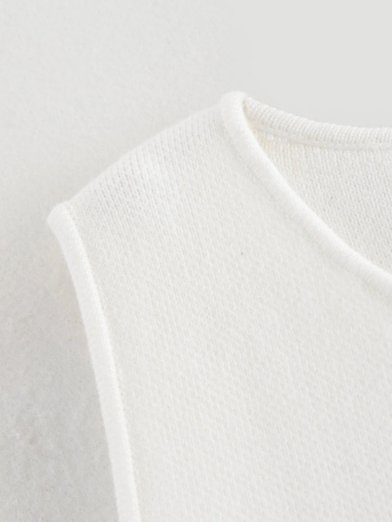 Pink sleeveless knit vest for women, cropped sweater top, yellow button design, streetwear waistcoat, stylish knitwear