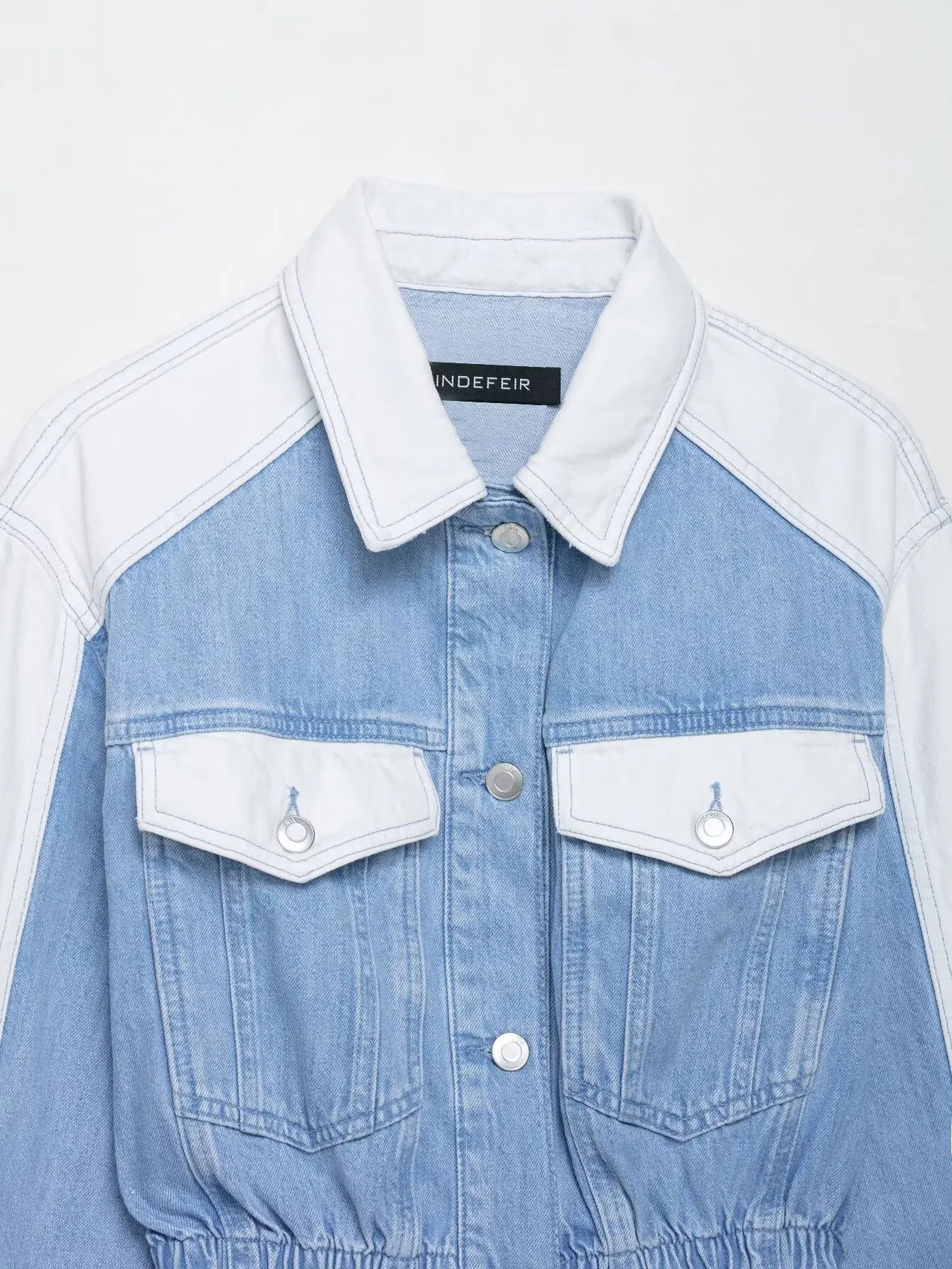 vintage denim women's outfit with a long-sleeve coat and wide-leg jeans